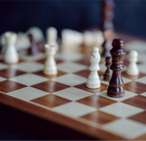Chessboard with pieces in mid-game position.